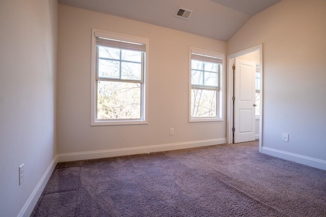 unfurnished room featuring baseboards, visible vents, carpet floors, and lofted ceiling