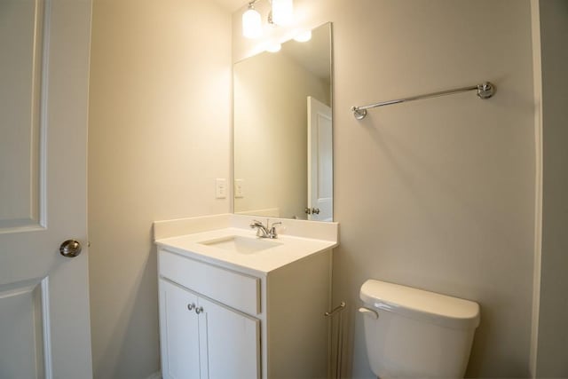 bathroom with toilet and vanity