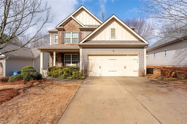 craftsman-style home featuring board and batten siding, driveway, and a garage