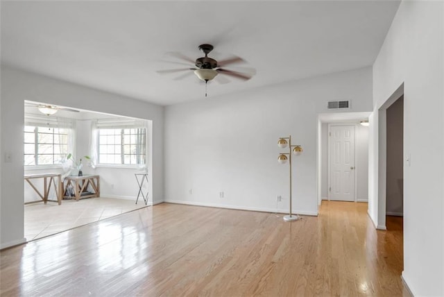 unfurnished room with ceiling fan and light hardwood / wood-style floors