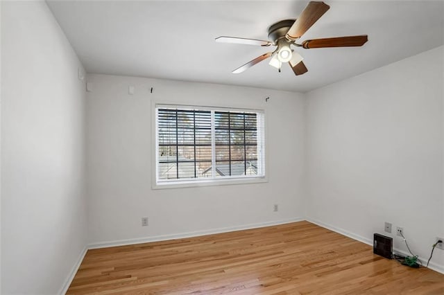 empty room featuring ceiling fan and light hardwood / wood-style floors