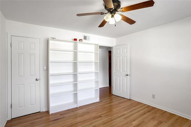 unfurnished bedroom featuring ceiling fan and light hardwood / wood-style flooring