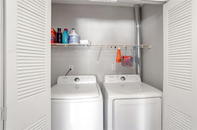 laundry area with separate washer and dryer