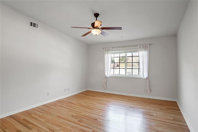 unfurnished room featuring ceiling fan, lofted ceiling, and light wood-type flooring