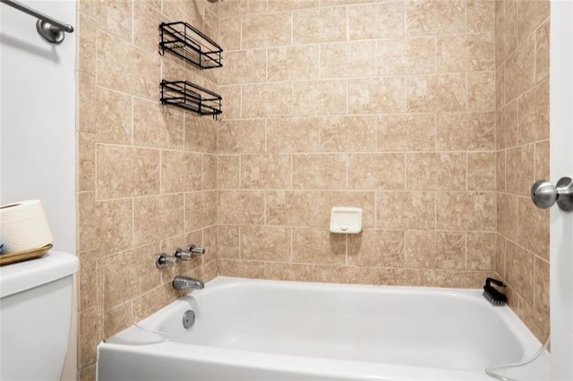 bathroom with tub / shower combination and toilet