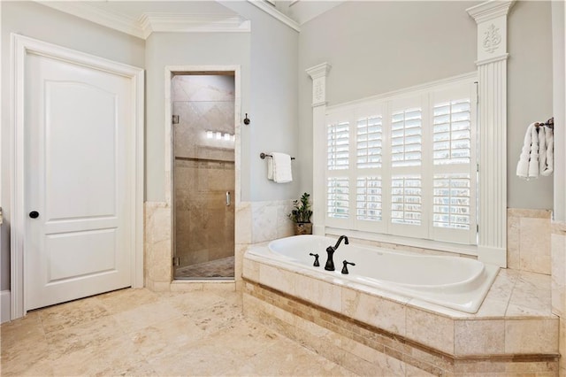 bathroom with shower with separate bathtub and ornamental molding