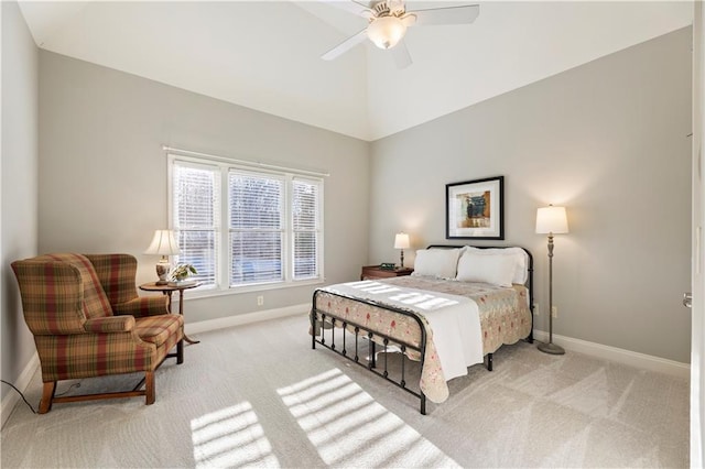 carpeted bedroom featuring ceiling fan and high vaulted ceiling