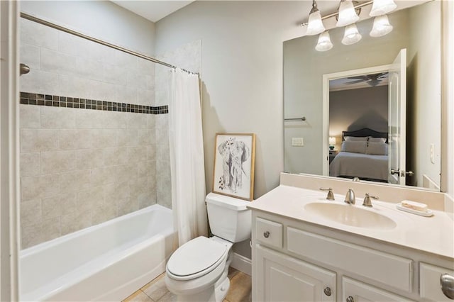 full bathroom with shower / bath combination with curtain, ceiling fan, toilet, and vanity