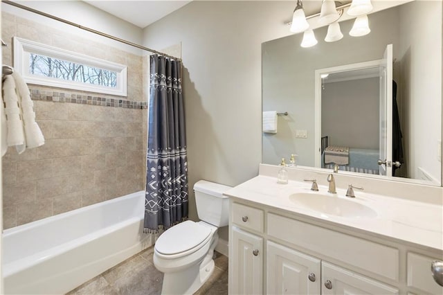 full bathroom with tile patterned floors, vanity, shower / tub combo, and toilet