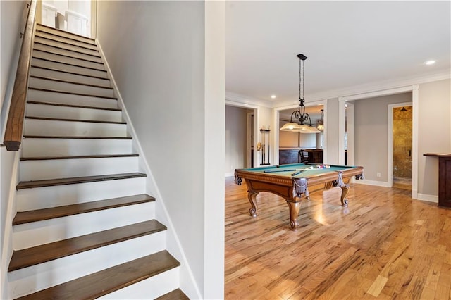 rec room with wood-type flooring, crown molding, and billiards