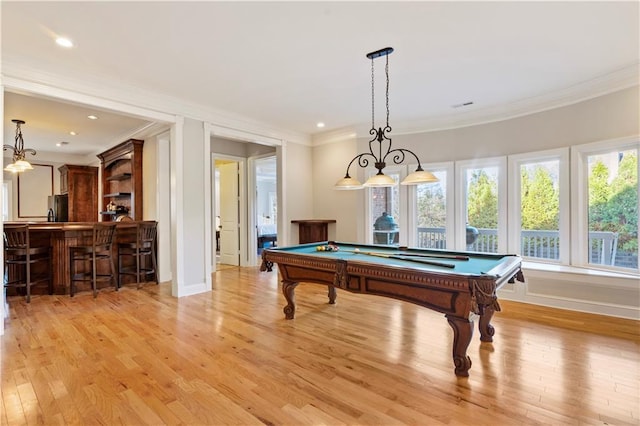 recreation room with bar area, light wood-type flooring, crown molding, and pool table