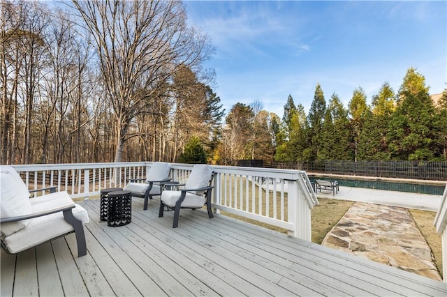 wooden terrace with a covered pool