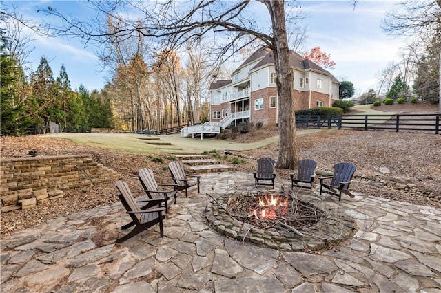 view of patio featuring a fire pit