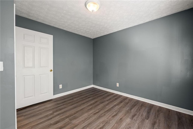 3303 Par Three Way, Lithonia, GA 30038 - unfurnished room featuring dark wood-style flooring and a textured ceiling