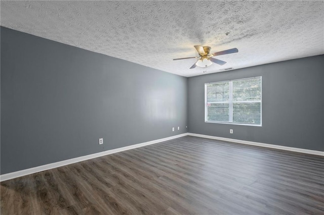 3303 Par Three Way, Lithonia, GA 30038 - spare room with dark wood-style flooring, ceiling fan, and a textured ceiling