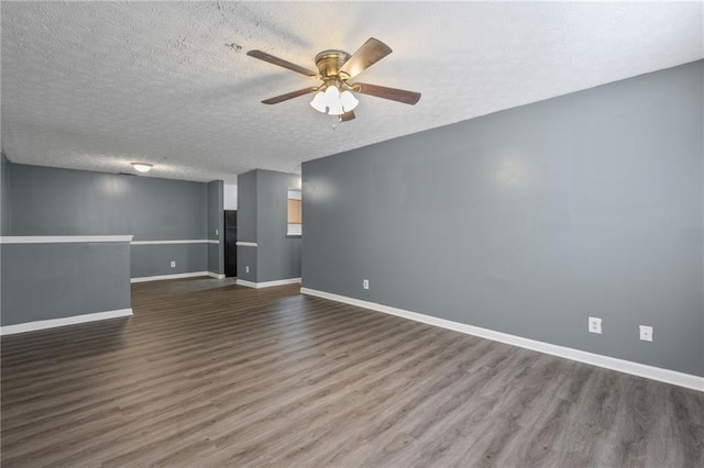 3303 Par Three Way, Lithonia, GA 30038 - spare room featuring dark wood finished floors, ceiling fan, and a textured ceiling