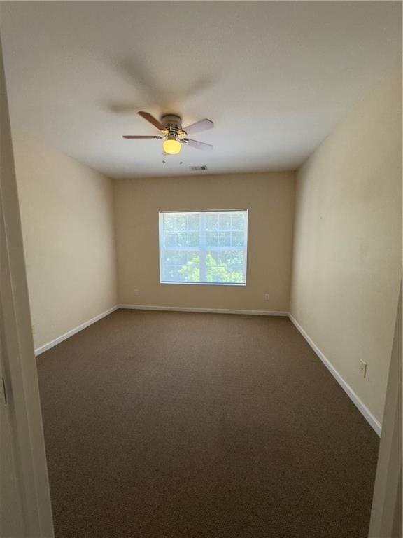 118 Pointe Cir, Dahlonega, GA 30533 - unfurnished room featuring dark colored carpet and a ceiling fan