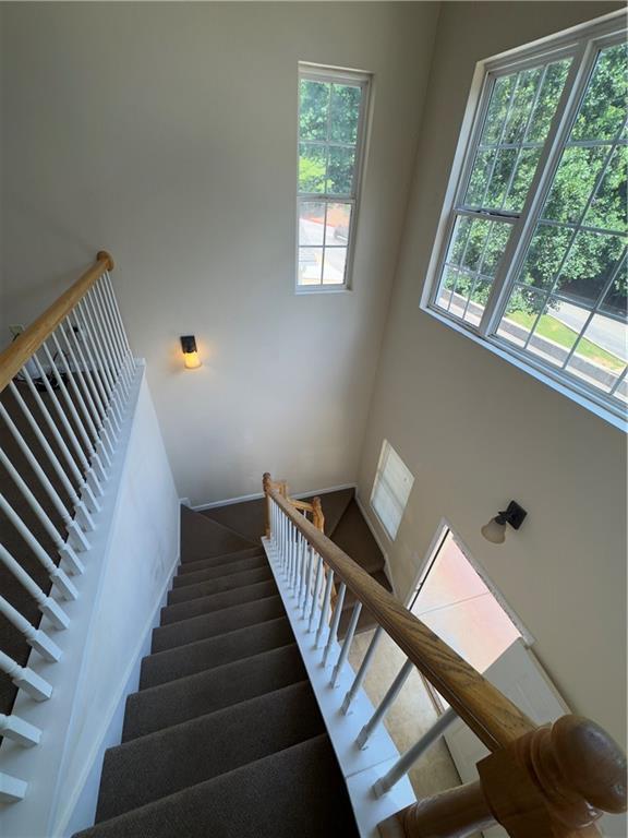 118 Pointe Cir, Dahlonega, GA 30533 - stairway featuring plenty of natural light