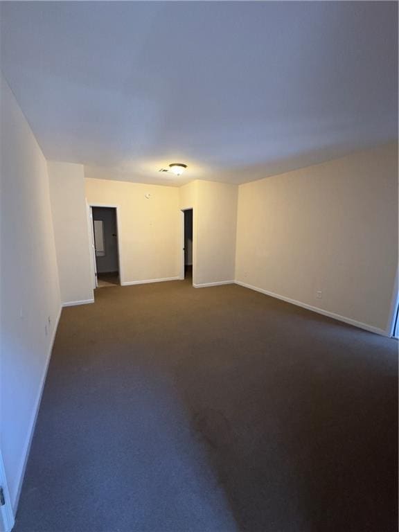 118 Pointe Cir, Dahlonega, GA 30533 - unfurnished room with baseboards and dark colored carpet