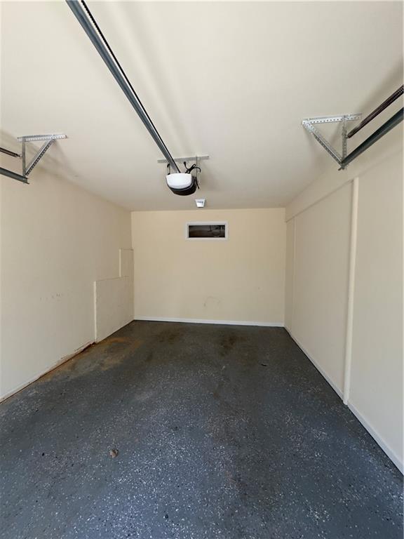 118 Pointe Cir, Dahlonega, GA 30533 - garage featuring a garage door opener