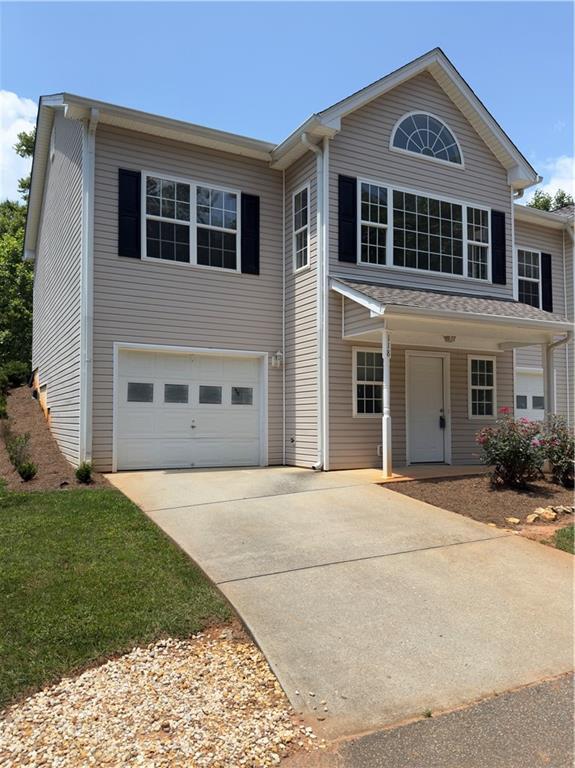 118 Pointe Cir, Dahlonega, GA 30533 - traditional-style house with a garage and concrete driveway