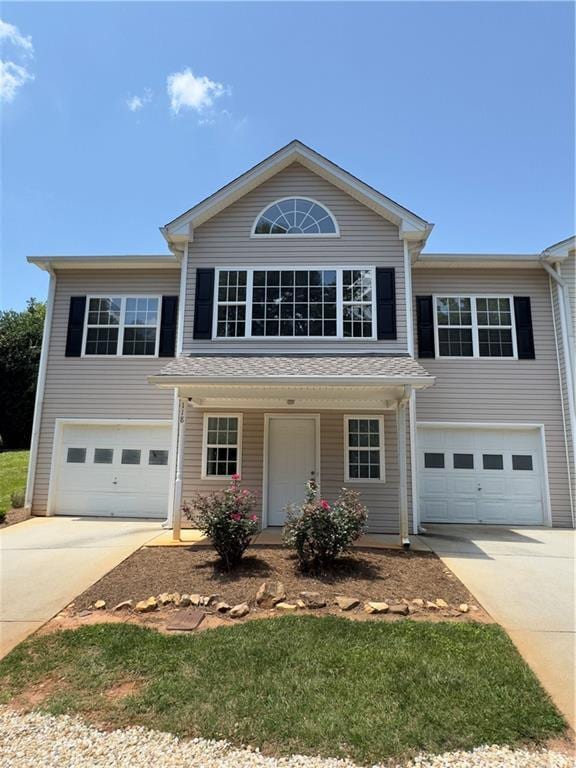 118 Pointe Cir, Dahlonega, GA 30533 - traditional home featuring concrete driveway, a garage, and a porch