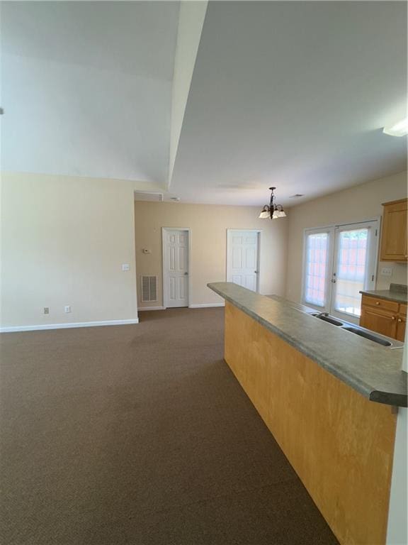 118 Pointe Cir, Dahlonega, GA 30533 - kitchen with a chandelier, dark carpet, and open floor plan