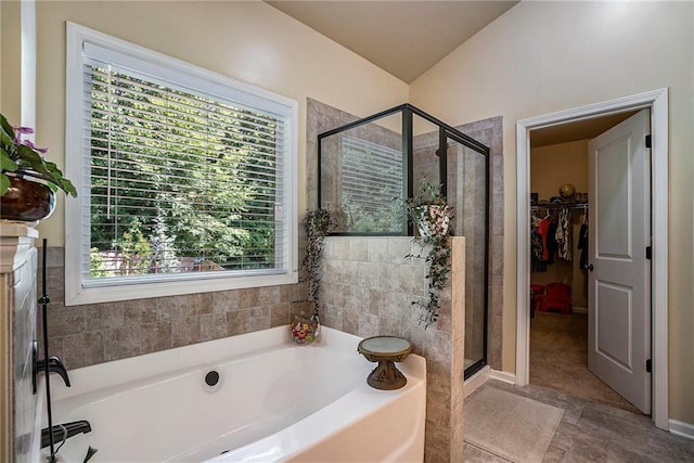 bathroom featuring separate shower and tub