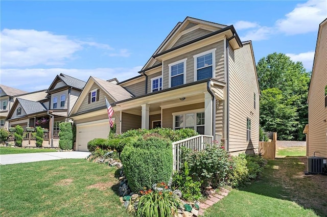 craftsman inspired home with central AC unit, a garage, a front yard, and a porch