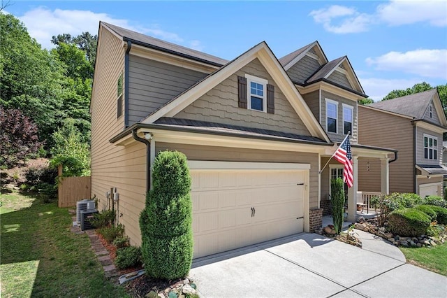 view of front of property featuring central AC, a garage, and a front lawn