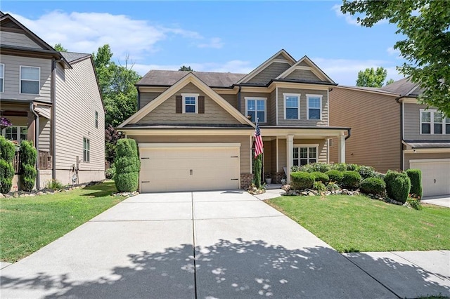 craftsman-style home featuring a garage and a front lawn