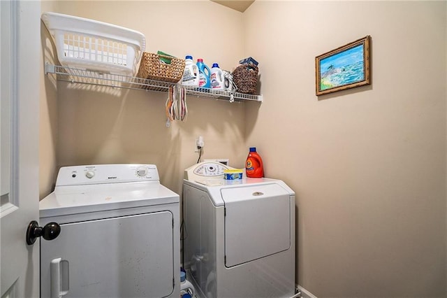 laundry area featuring washing machine and clothes dryer