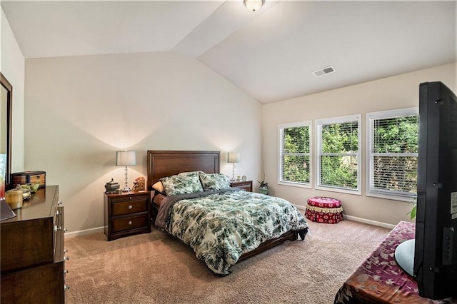 carpeted bedroom featuring vaulted ceiling