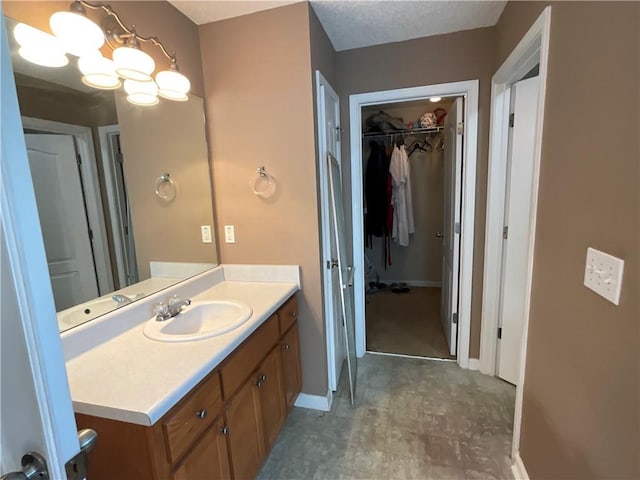 bathroom with vanity and a textured ceiling