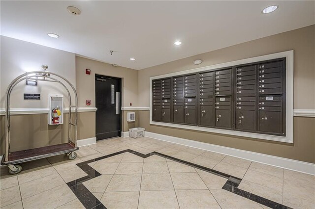 kitchen with hanging light fixtures, dark brown cabinets, stainless steel dishwasher, and ornamental molding