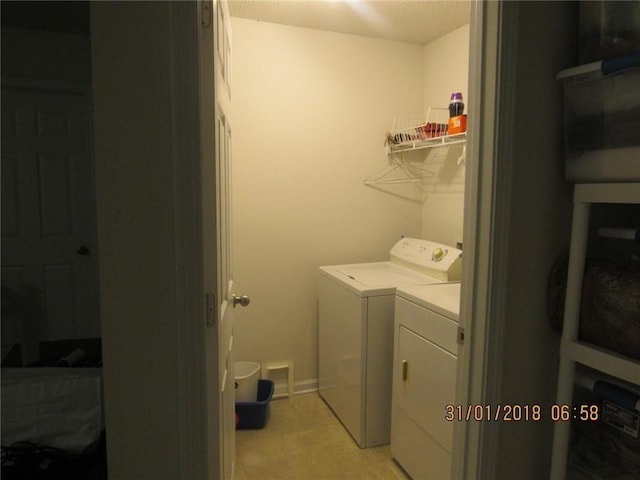 laundry area featuring laundry area and separate washer and dryer