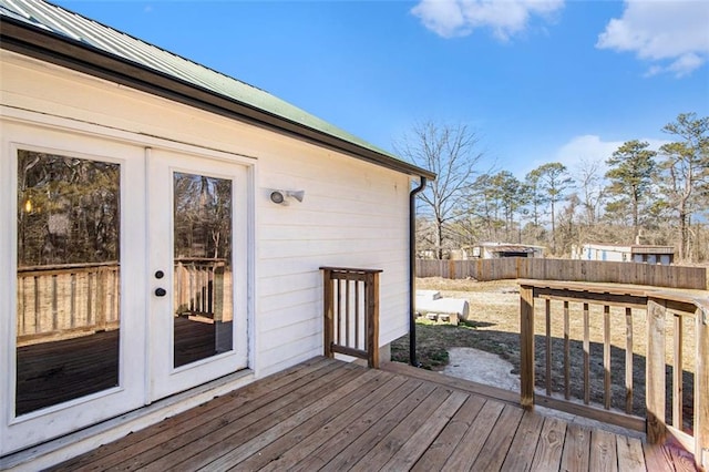 wooden deck with fence and french doors