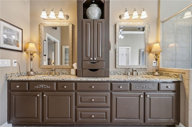 full bath featuring double vanity and a sink