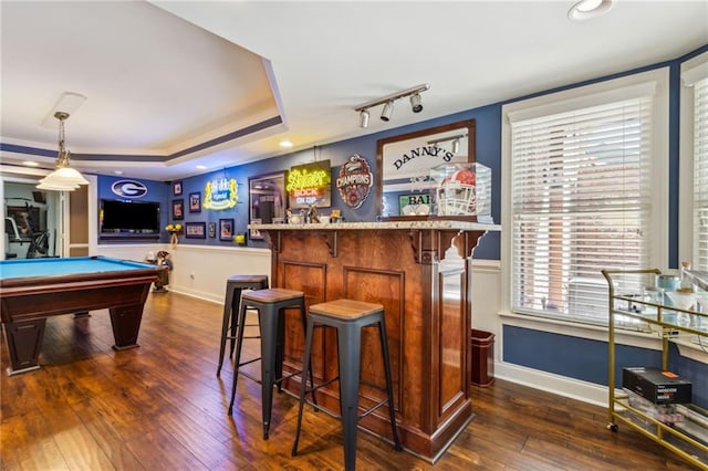 bar featuring dark wood-type flooring, billiards, baseboards, a dry bar, and a raised ceiling