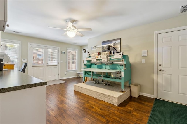 foyer with visible vents, dark wood-type flooring, a ceiling fan, and baseboards