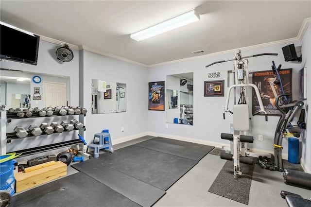 gym featuring baseboards, visible vents, and crown molding