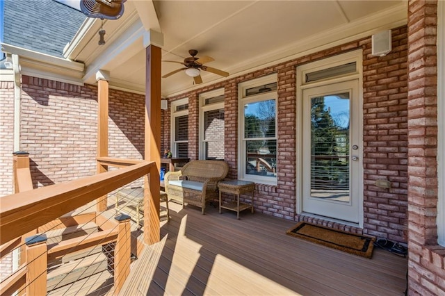 wooden terrace with a ceiling fan