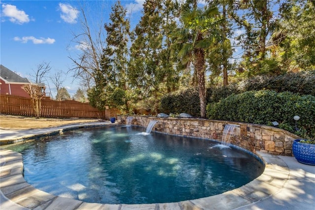 view of pool with a fenced in pool and fence