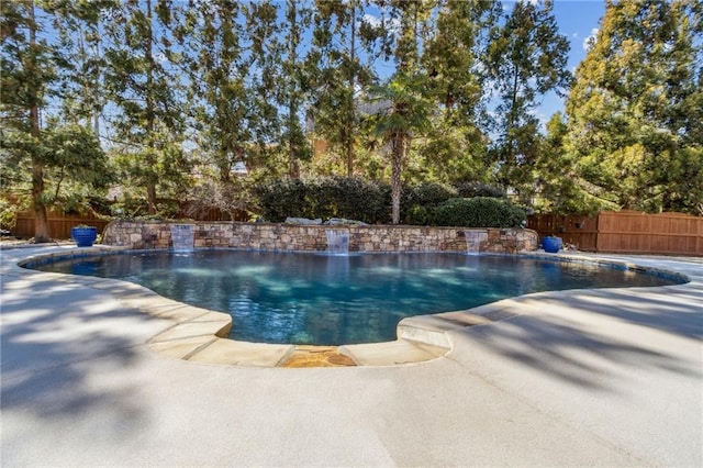 view of swimming pool with a patio area, a fenced backyard, and a fenced in pool