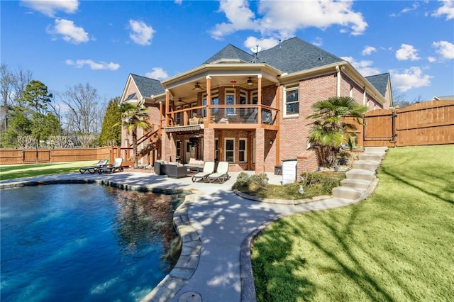 rear view of house with a ceiling fan, a patio, a fenced backyard, a gate, and brick siding