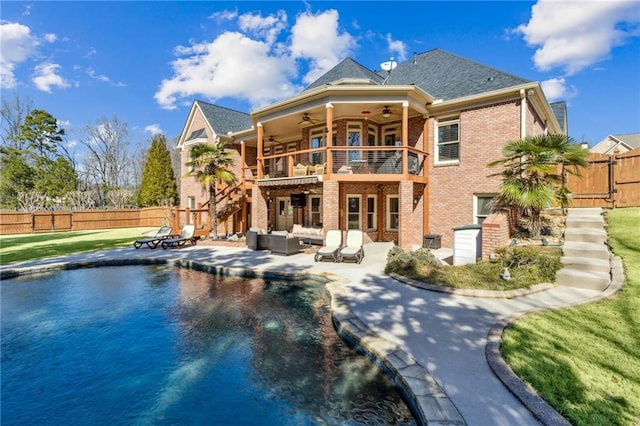 back of house featuring a ceiling fan, a patio area, brick siding, and fence