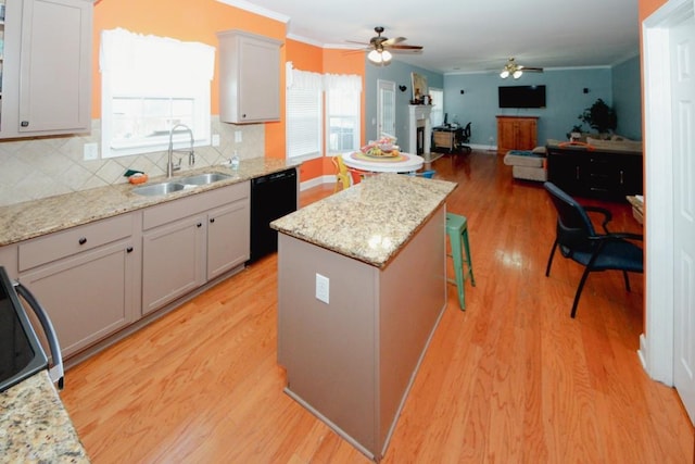 kitchen with decorative backsplash, dishwasher, light wood-style flooring, crown molding, and a sink