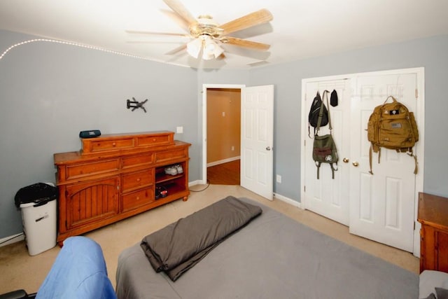 bedroom featuring a ceiling fan and baseboards