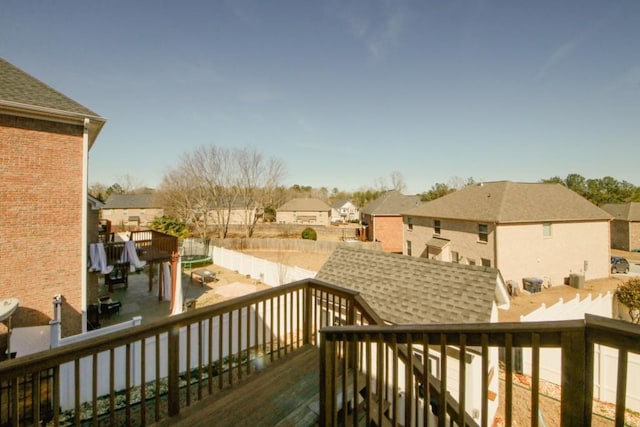 wooden deck featuring a residential view