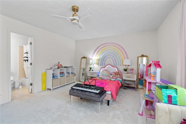 carpeted bedroom featuring ceiling fan and connected bathroom